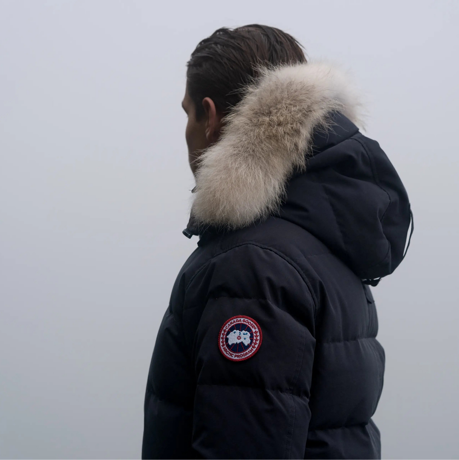 Person wearing a black Canada Goose Carson jacket 